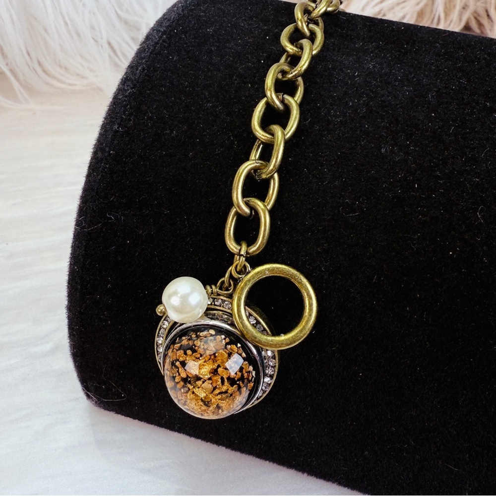Beautiful bronze town, toggle closure, ginger snap charm bracelet